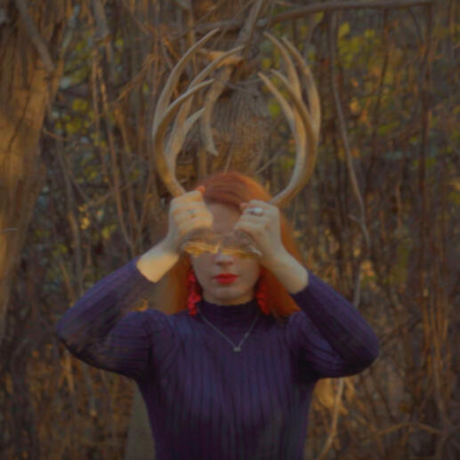 a photo of rose mckenna in forest